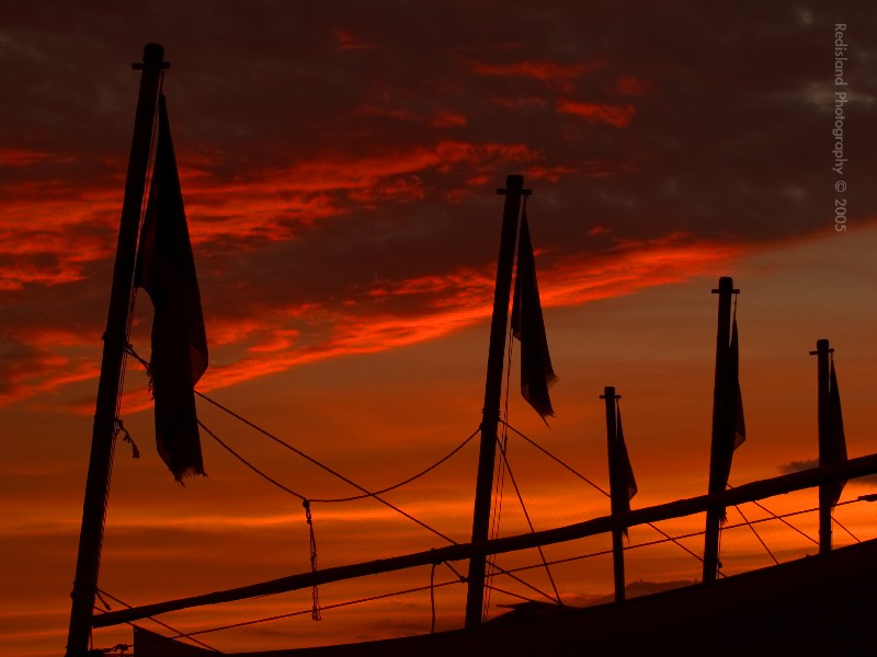Flags on sunset