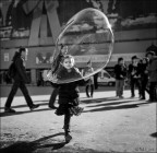 Child playing with huge bubble Child playing with huge bubble