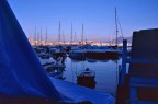 A look at what is beyond a tend long the seaport of Naples at blue hour