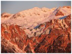 Prima illuminazione  solare sul Monte Carega: vista del versante sud-est dai pressi di Recoaro Mille. Piccole Dolomiti. Gennaio 2024