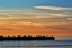 Spettatori del tramonto sul Molo Audace Spettatori del tramonto sul Molo Audace